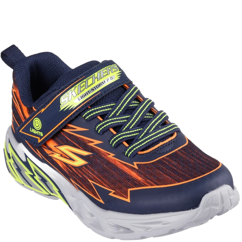 Skechers børnesneaker med mesh og syntetisk overdel, lyseffekter i mellemsålen, elastiske snørebånd + velcrolukning for nem af- og påtagning og en fleksibel ydersål med godt greb.