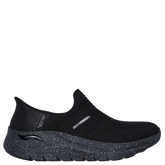 Skechers slip-ins dame sneakers i sort, model med strikket overdel og prikket, stødabsorberende sål. I det at den er en slip-ins model er den nem at tage på uden at bøje sig. Komfortabel og sporty, perfekt til hverdagsbrug.